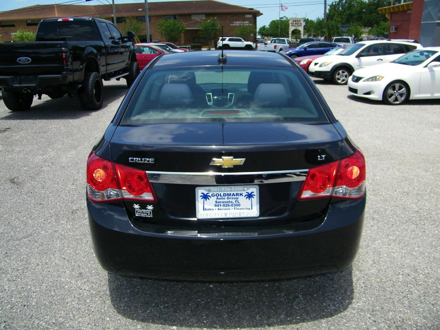 2015 Black /Black Chevrolet Cruze 1LT Auto (1G1PC5SB7F7) with an 1.4L L4 DOHC 16V TURBO engine, 6-Speed Automatic transmission, located at 4000 Bee Ridge Road, Sarasota, FL, 34233, (941) 926-0300, 27.298664, -82.489151 - Photo#4