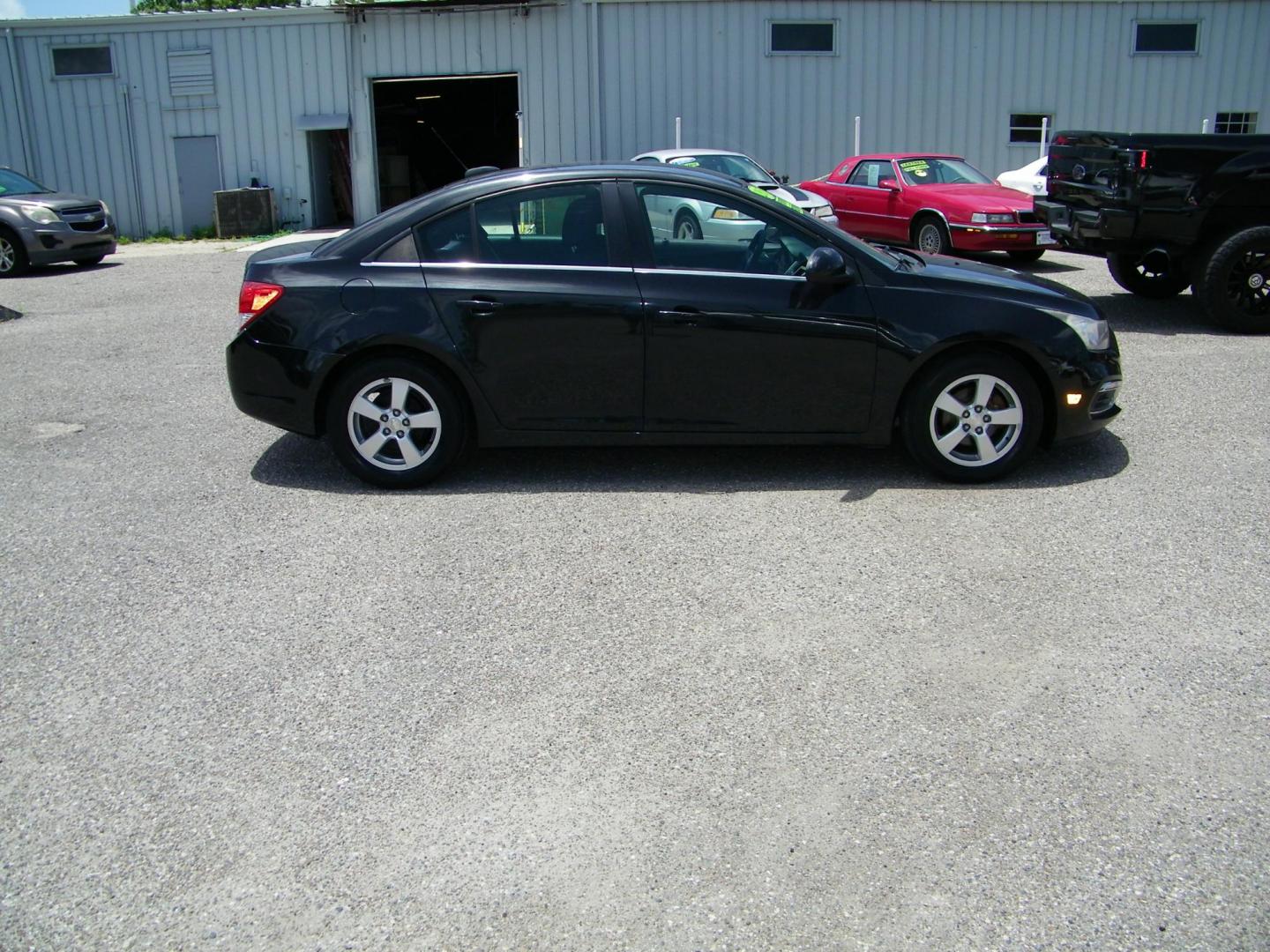 2015 Black /Black Chevrolet Cruze 1LT Auto (1G1PC5SB7F7) with an 1.4L L4 DOHC 16V TURBO engine, 6-Speed Automatic transmission, located at 4000 Bee Ridge Road, Sarasota, FL, 34233, (941) 926-0300, 27.298664, -82.489151 - Photo#6