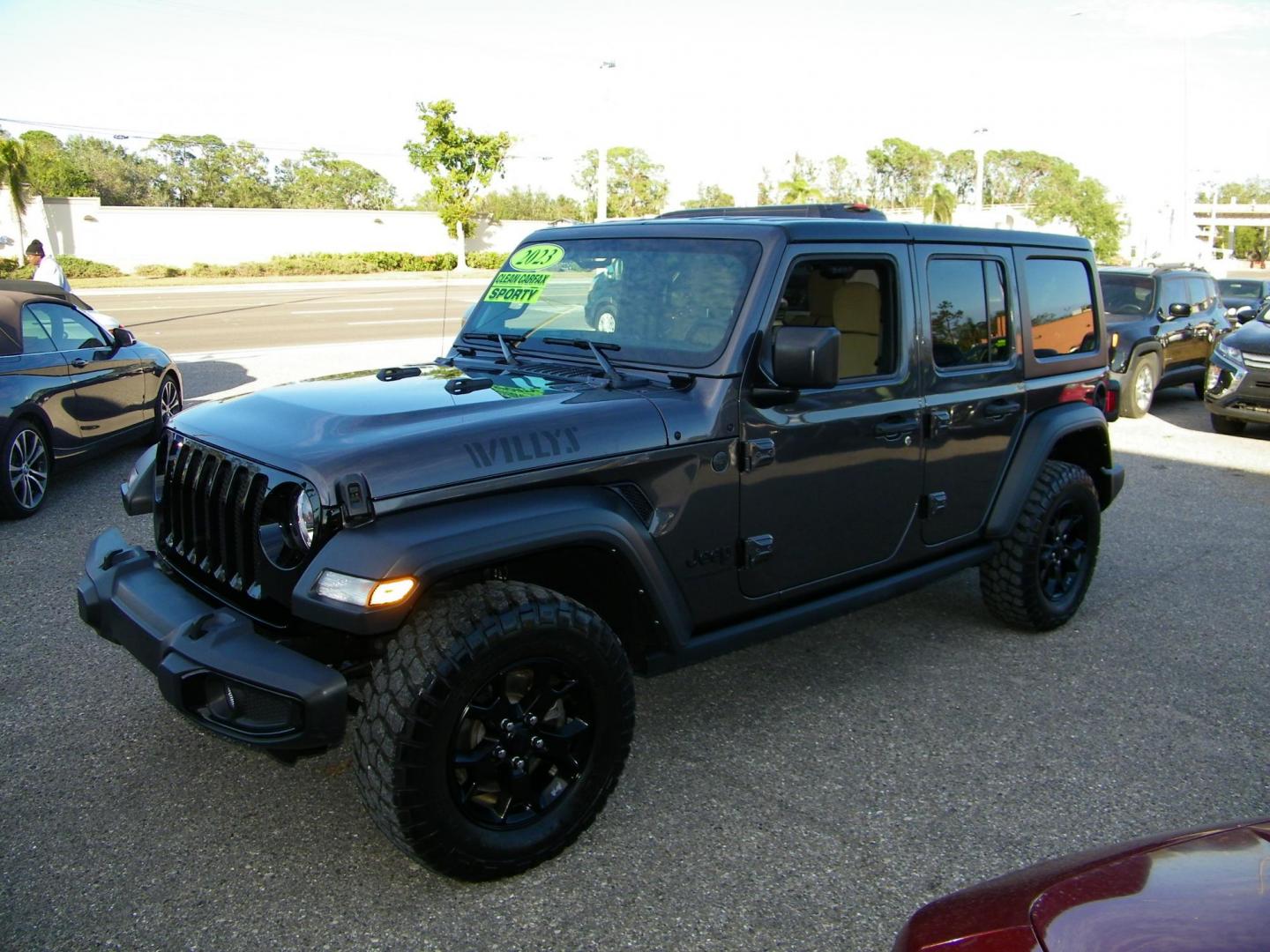 2023 Gray /Tan Jeep Wrangler Unlimited Sport (1C4HJXDG9PW) with an 3.6L V6 DOHC 24V FFV engine, 6A transmission, located at 4000 Bee Ridge Road, Sarasota, FL, 34233, (941) 926-0300, 27.298664, -82.489151 - Photo#1