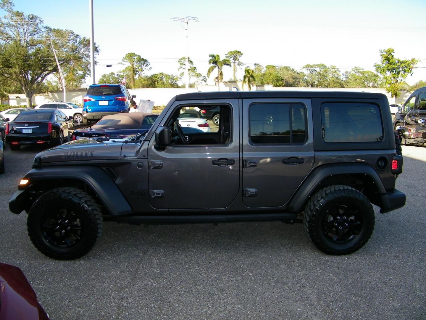 2023 Gray /Tan Jeep Wrangler Unlimited Sport (1C4HJXDG9PW) with an 3.6L V6 DOHC 24V FFV engine, 6A transmission, located at 4000 Bee Ridge Road, Sarasota, FL, 34233, (941) 926-0300, 27.298664, -82.489151 - Photo#2