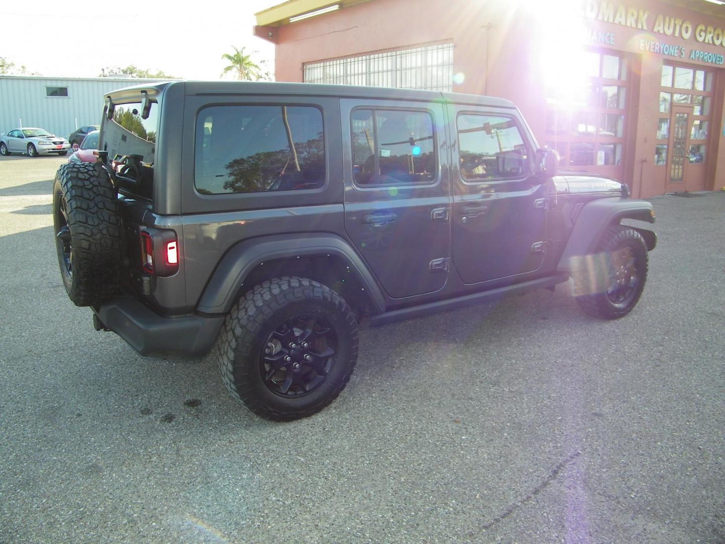 2023 Gray /Tan Jeep Wrangler Unlimited Sport (1C4HJXDG9PW) with an 3.6L V6 DOHC 24V FFV engine, 6A transmission, located at 4000 Bee Ridge Road, Sarasota, FL, 34233, (941) 926-0300, 27.298664, -82.489151 - Photo#4