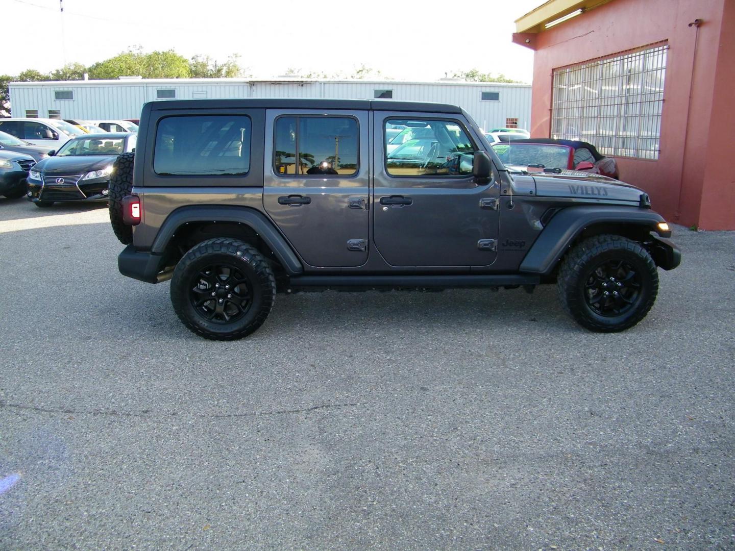 2023 Gray /Tan Jeep Wrangler Unlimited Sport (1C4HJXDG9PW) with an 3.6L V6 DOHC 24V FFV engine, 6A transmission, located at 4000 Bee Ridge Road, Sarasota, FL, 34233, (941) 926-0300, 27.298664, -82.489151 - Photo#6