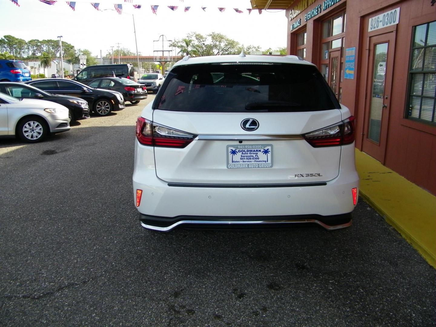 2022 White /Beige Lexus RX 350L FWD (JTJHZKEA5N2) with an 3.5L V6 DOHC 24V engine, 6A transmission, located at 4000 Bee Ridge Road, Sarasota, FL, 34233, (941) 926-0300, 27.298664, -82.489151 - Photo#4
