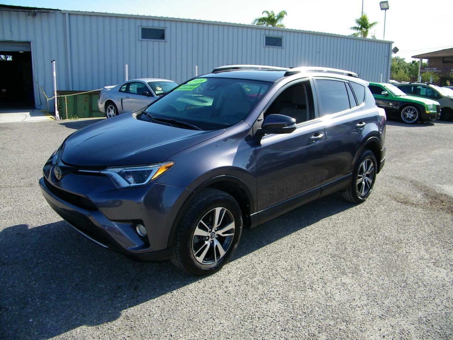 2018 Gray /Beige Toyota RAV4 XLE FWD (JTMWFREV9JJ) with an 2.5L L4 DOHC 16V engine, 6A transmission, located at 4000 Bee Ridge Road, Sarasota, FL, 34233, (941) 926-0300, 27.298664, -82.489151 - Photo#0