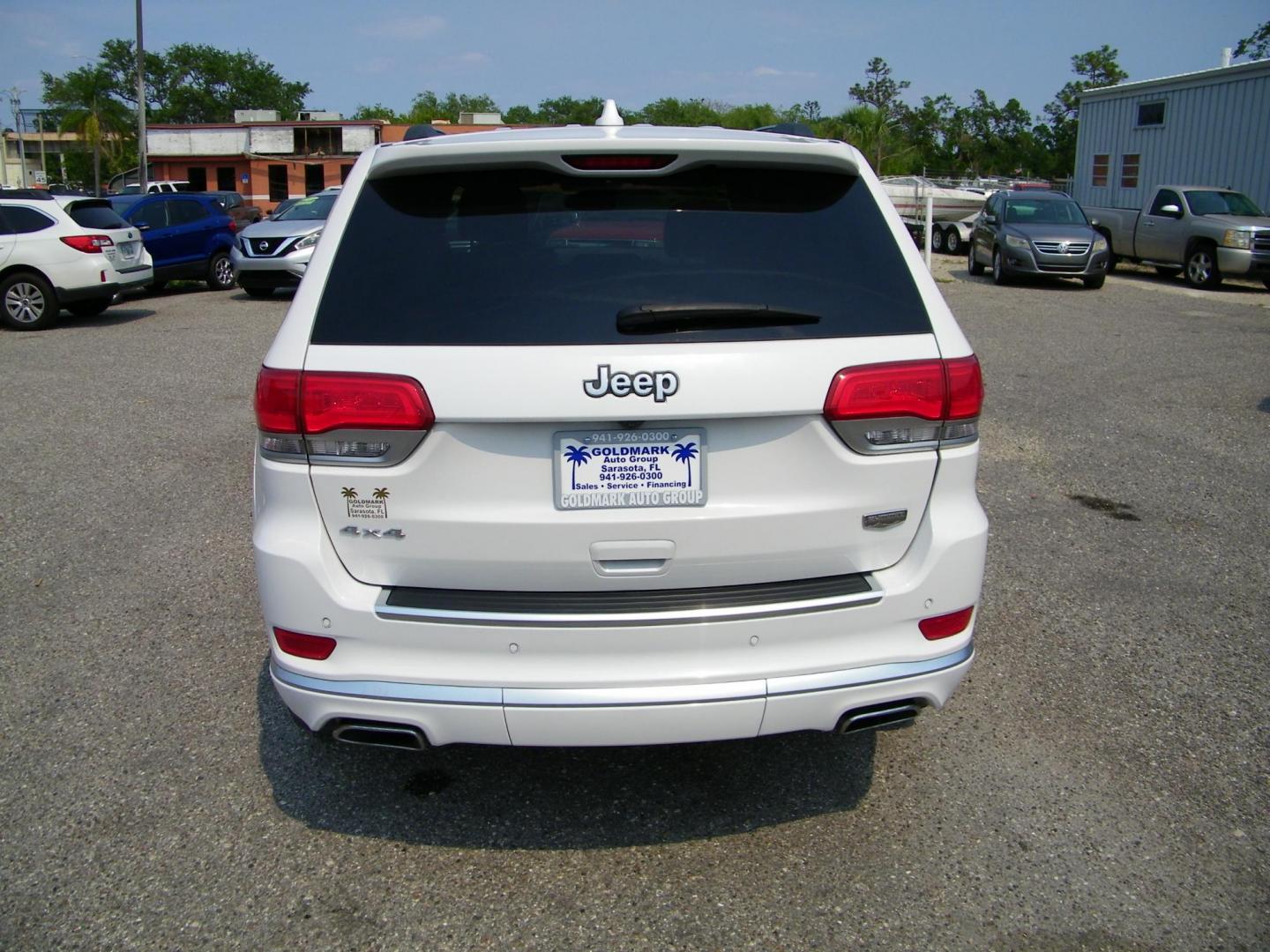 2019 White /Saddle Jeep Grand Cherokee Summit 4WD (1C4RJFJG5KC) with an 3.6L V6 DOHC 24V engine, 8A transmission, located at 4000 Bee Ridge Road, Sarasota, FL, 34233, (941) 926-0300, 27.298664, -82.489151 - Photo#4