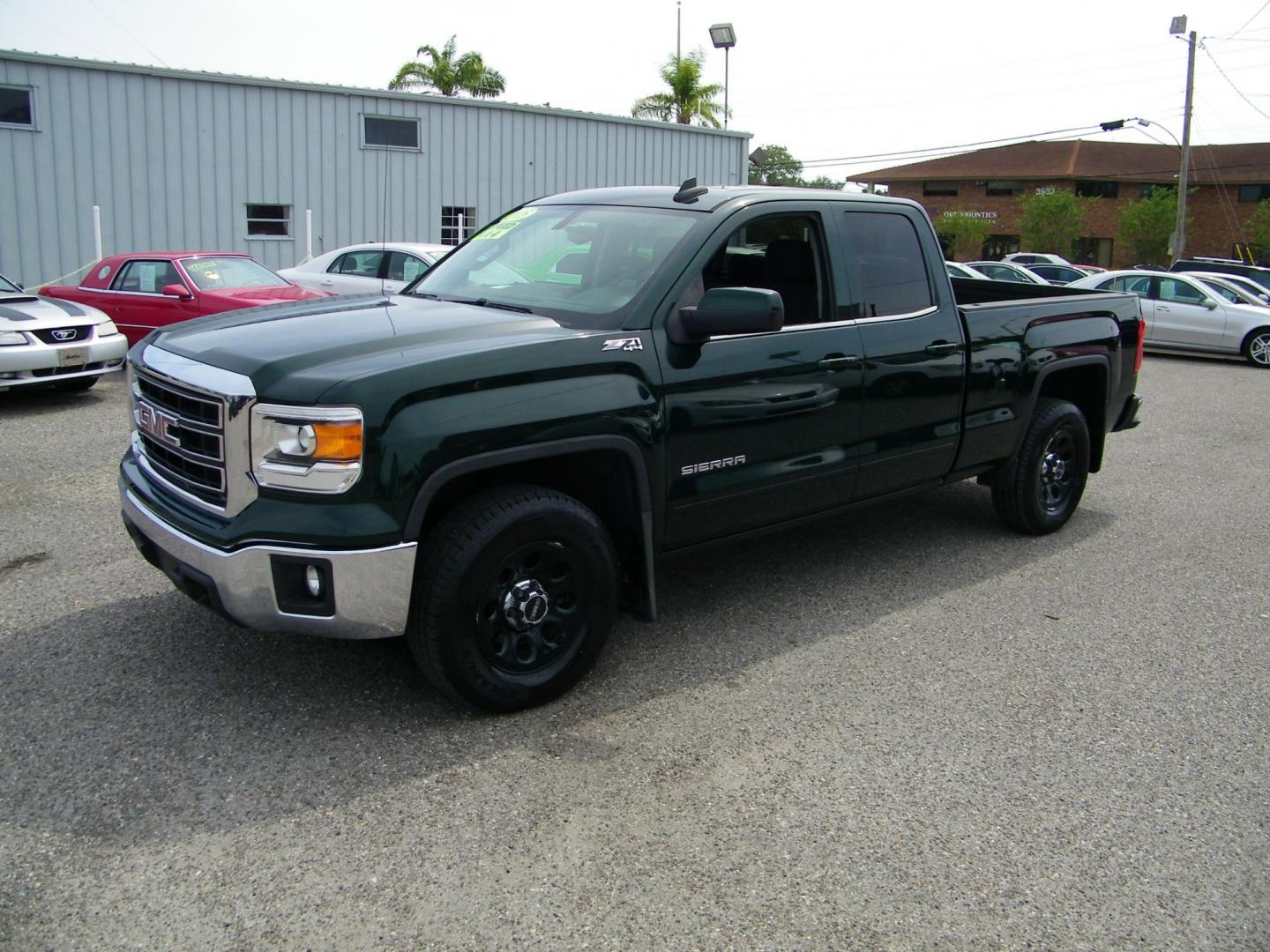 2015 Green /Black GMC Sierra 1500 SLE Double Cab 4WD (1GTV2UEC0FZ) with an 5.3L V8 OHV 16V engine, 6-Speed Automatic transmission, located at 4000 Bee Ridge Road, Sarasota, FL, 34233, (941) 926-0300, 27.298664, -82.489151 - Photo#0