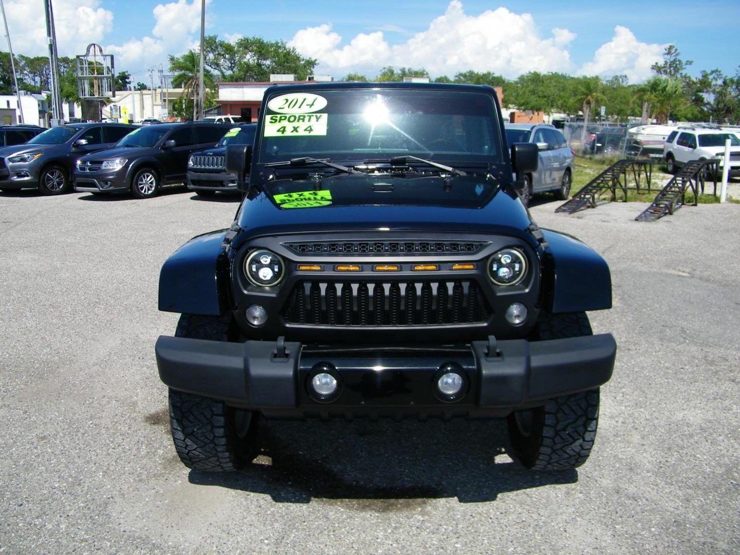 2014 Black /Black Jeep Wrangler Unlimited Sahara 4WD (1C4BJWEG2EL) with an 3.6L V6 DOHC 24V FFV engine, Automatic transmission, located at 4000 Bee Ridge Road, Sarasota, FL, 34233, (941) 926-0300, 27.298664, -82.489151 - Photo#1