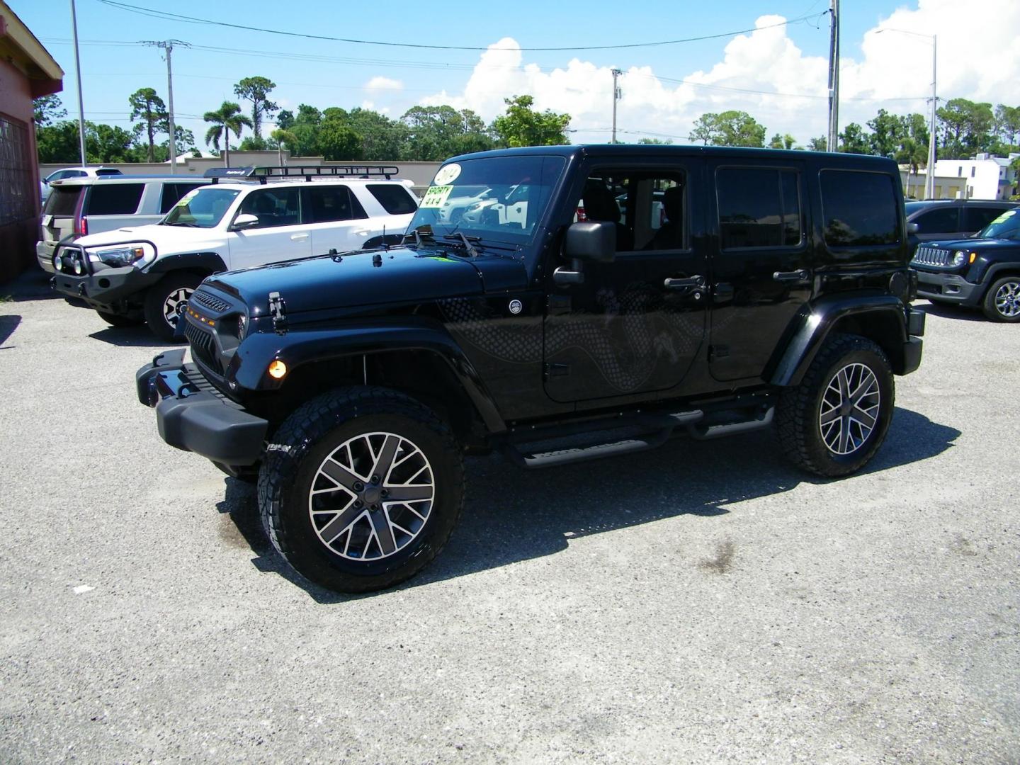 2014 Black /Black Jeep Wrangler Unlimited Sahara 4WD (1C4BJWEG2EL) with an 3.6L V6 DOHC 24V FFV engine, Automatic transmission, located at 4000 Bee Ridge Road, Sarasota, FL, 34233, (941) 926-0300, 27.298664, -82.489151 - Photo#0