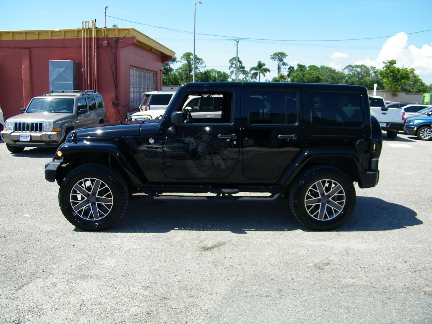 2014 Black /Black Jeep Wrangler Unlimited Sahara 4WD (1C4BJWEG2EL) with an 3.6L V6 DOHC 24V FFV engine, Automatic transmission, located at 4000 Bee Ridge Road, Sarasota, FL, 34233, (941) 926-0300, 27.298664, -82.489151 - Photo#2