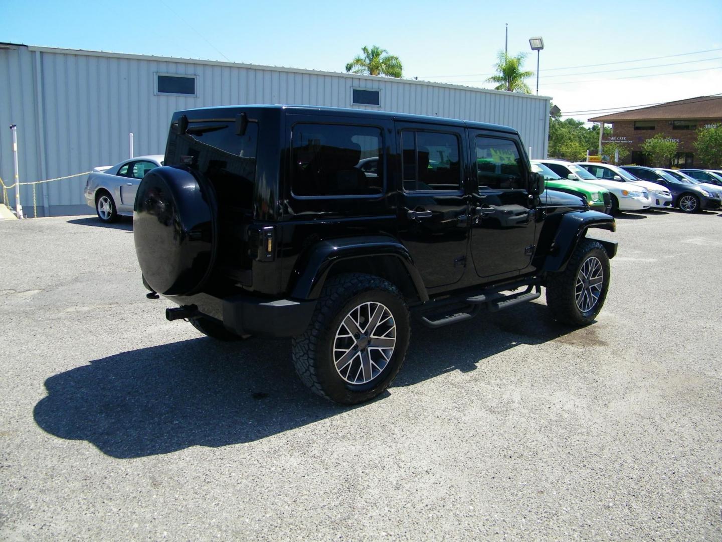 2014 Black /Black Jeep Wrangler Unlimited Sahara 4WD (1C4BJWEG2EL) with an 3.6L V6 DOHC 24V FFV engine, Automatic transmission, located at 4000 Bee Ridge Road, Sarasota, FL, 34233, (941) 926-0300, 27.298664, -82.489151 - Photo#5