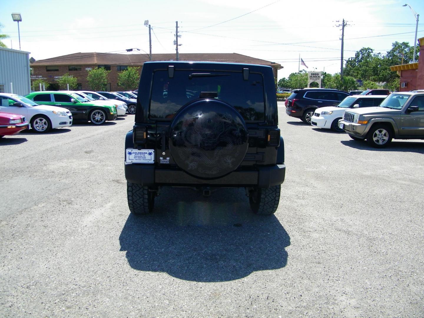 2014 Black /Black Jeep Wrangler Unlimited Sahara 4WD (1C4BJWEG2EL) with an 3.6L V6 DOHC 24V FFV engine, Automatic transmission, located at 4000 Bee Ridge Road, Sarasota, FL, 34233, (941) 926-0300, 27.298664, -82.489151 - Photo#4
