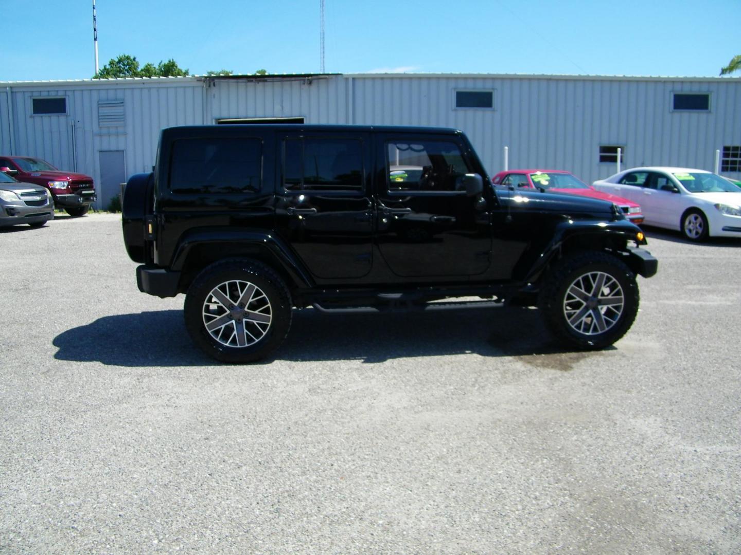 2014 Black /Black Jeep Wrangler Unlimited Sahara 4WD (1C4BJWEG2EL) with an 3.6L V6 DOHC 24V FFV engine, Automatic transmission, located at 4000 Bee Ridge Road, Sarasota, FL, 34233, (941) 926-0300, 27.298664, -82.489151 - Photo#6