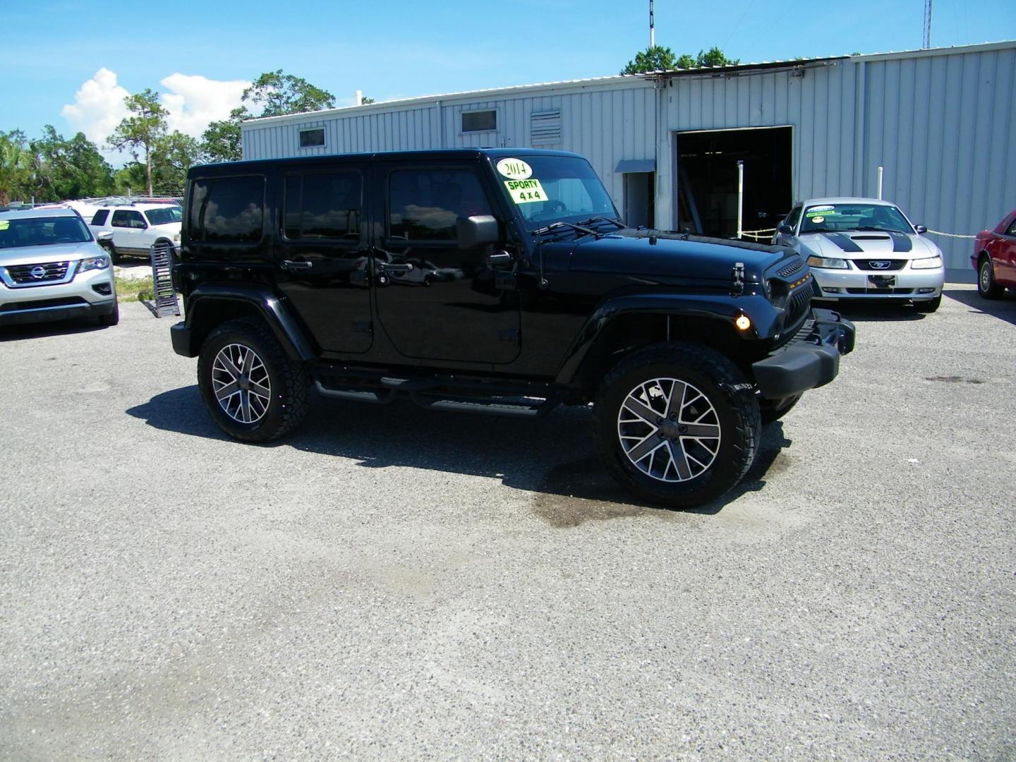 2014 Black /Black Jeep Wrangler Unlimited Sahara 4WD (1C4BJWEG2EL) with an 3.6L V6 DOHC 24V FFV engine, Automatic transmission, located at 4000 Bee Ridge Road, Sarasota, FL, 34233, (941) 926-0300, 27.298664, -82.489151 - Photo#7