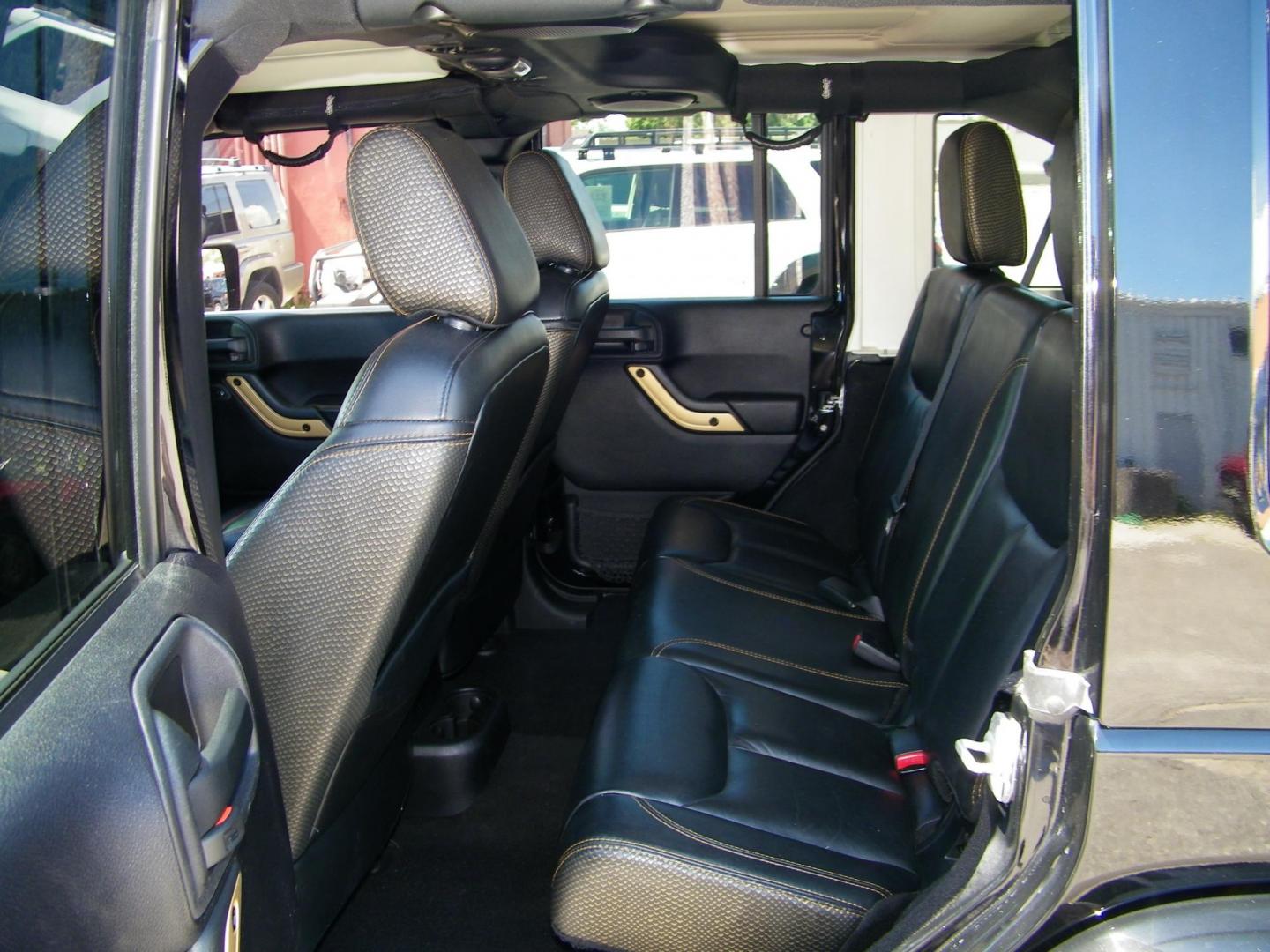 2014 Black /Black Jeep Wrangler Unlimited Sahara 4WD (1C4BJWEG2EL) with an 3.6L V6 DOHC 24V FFV engine, Automatic transmission, located at 4000 Bee Ridge Road, Sarasota, FL, 34233, (941) 926-0300, 27.298664, -82.489151 - Photo#10