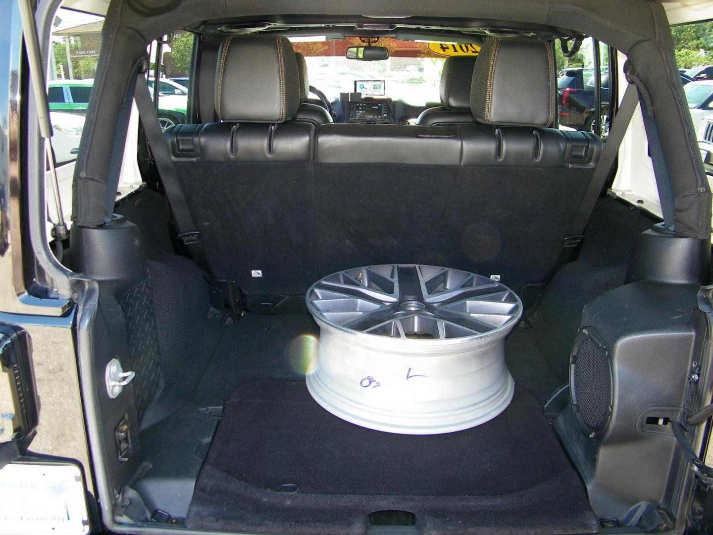 2014 Black /Black Jeep Wrangler Unlimited Sahara 4WD (1C4BJWEG2EL) with an 3.6L V6 DOHC 24V FFV engine, Automatic transmission, located at 4000 Bee Ridge Road, Sarasota, FL, 34233, (941) 926-0300, 27.298664, -82.489151 - Photo#11