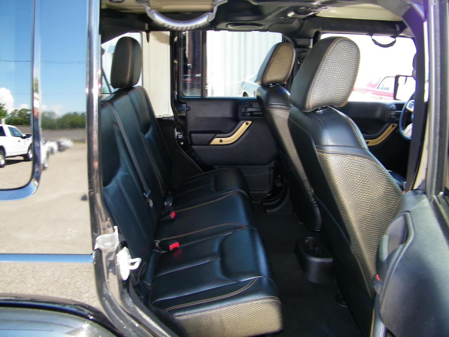 2014 Black /Black Jeep Wrangler Unlimited Sahara 4WD (1C4BJWEG2EL) with an 3.6L V6 DOHC 24V FFV engine, Automatic transmission, located at 4000 Bee Ridge Road, Sarasota, FL, 34233, (941) 926-0300, 27.298664, -82.489151 - Photo#12