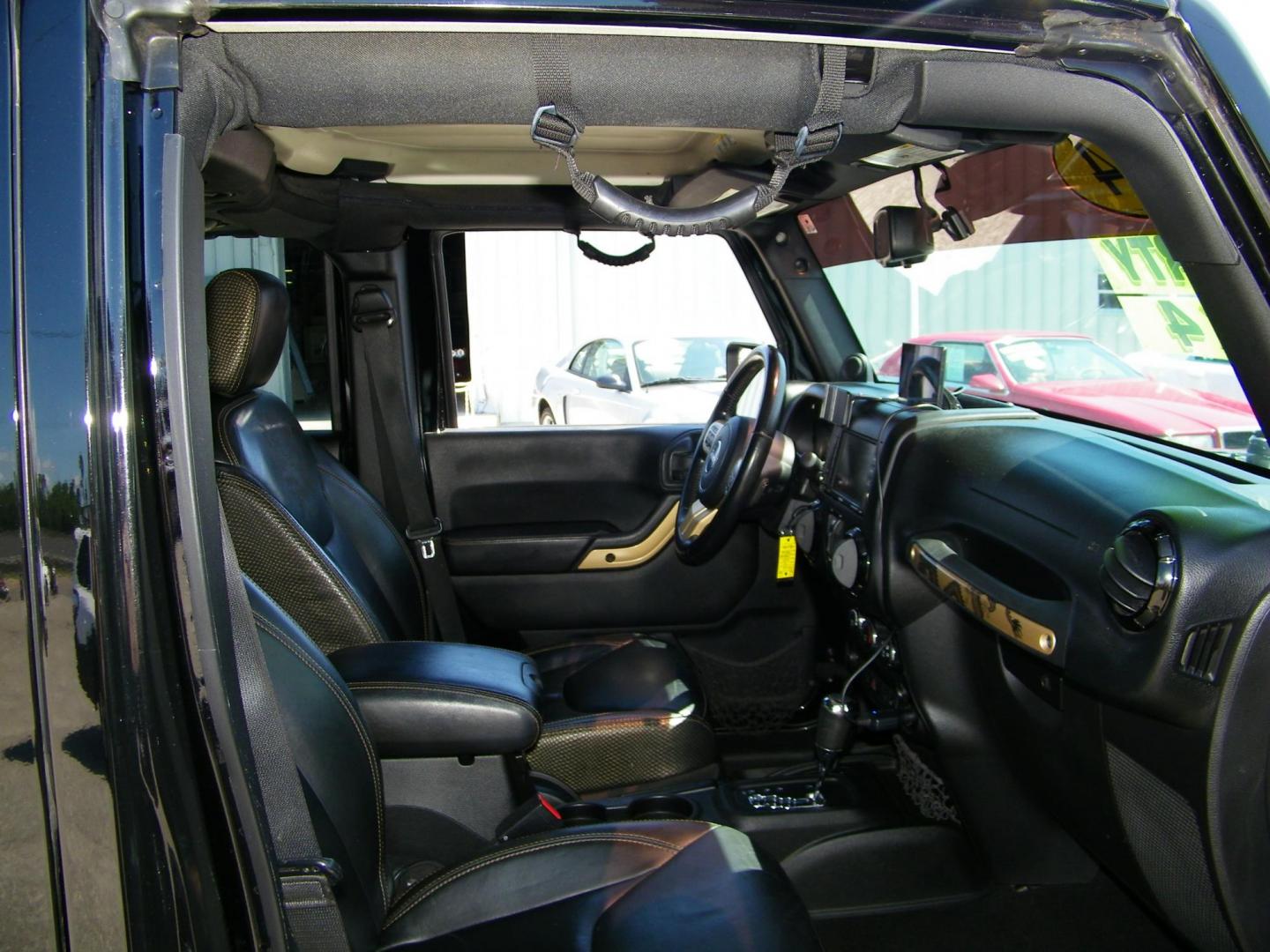 2014 Black /Black Jeep Wrangler Unlimited Sahara 4WD (1C4BJWEG2EL) with an 3.6L V6 DOHC 24V FFV engine, Automatic transmission, located at 4000 Bee Ridge Road, Sarasota, FL, 34233, (941) 926-0300, 27.298664, -82.489151 - Photo#14