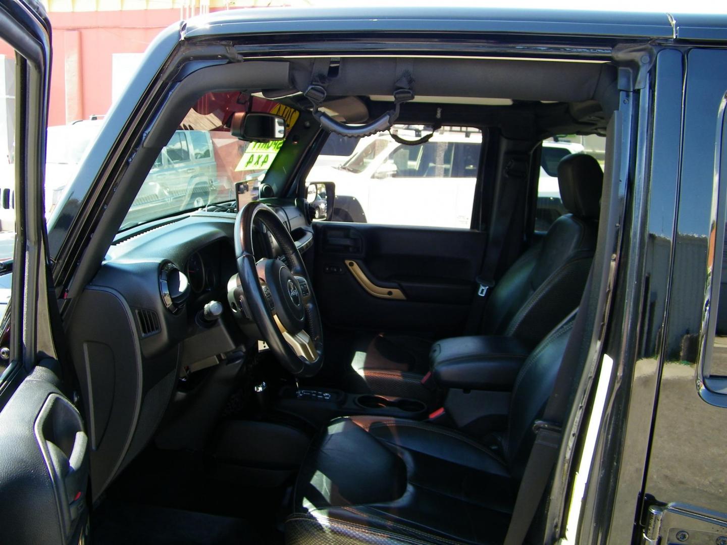 2014 Black /Black Jeep Wrangler Unlimited Sahara 4WD (1C4BJWEG2EL) with an 3.6L V6 DOHC 24V FFV engine, Automatic transmission, located at 4000 Bee Ridge Road, Sarasota, FL, 34233, (941) 926-0300, 27.298664, -82.489151 - Photo#16