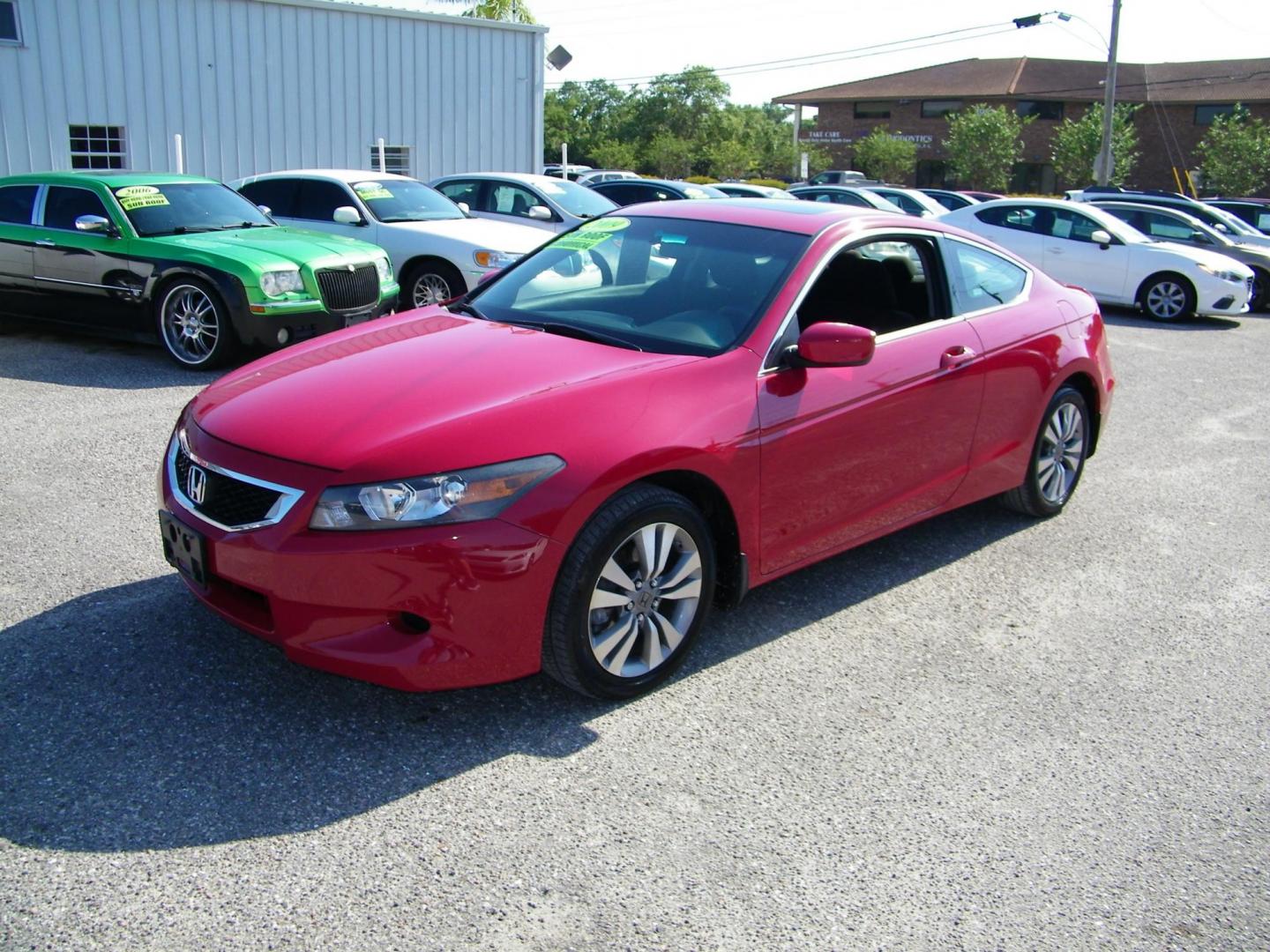 2009 Red /Black Honda Accord EX Coupe AT (1HGCS12759A) with an 2.4L L4 DOHC 16V engine, 5-Speed Automatic transmission, located at 4000 Bee Ridge Road, Sarasota, FL, 34233, (941) 926-0300, 27.298664, -82.489151 - Photo#0
