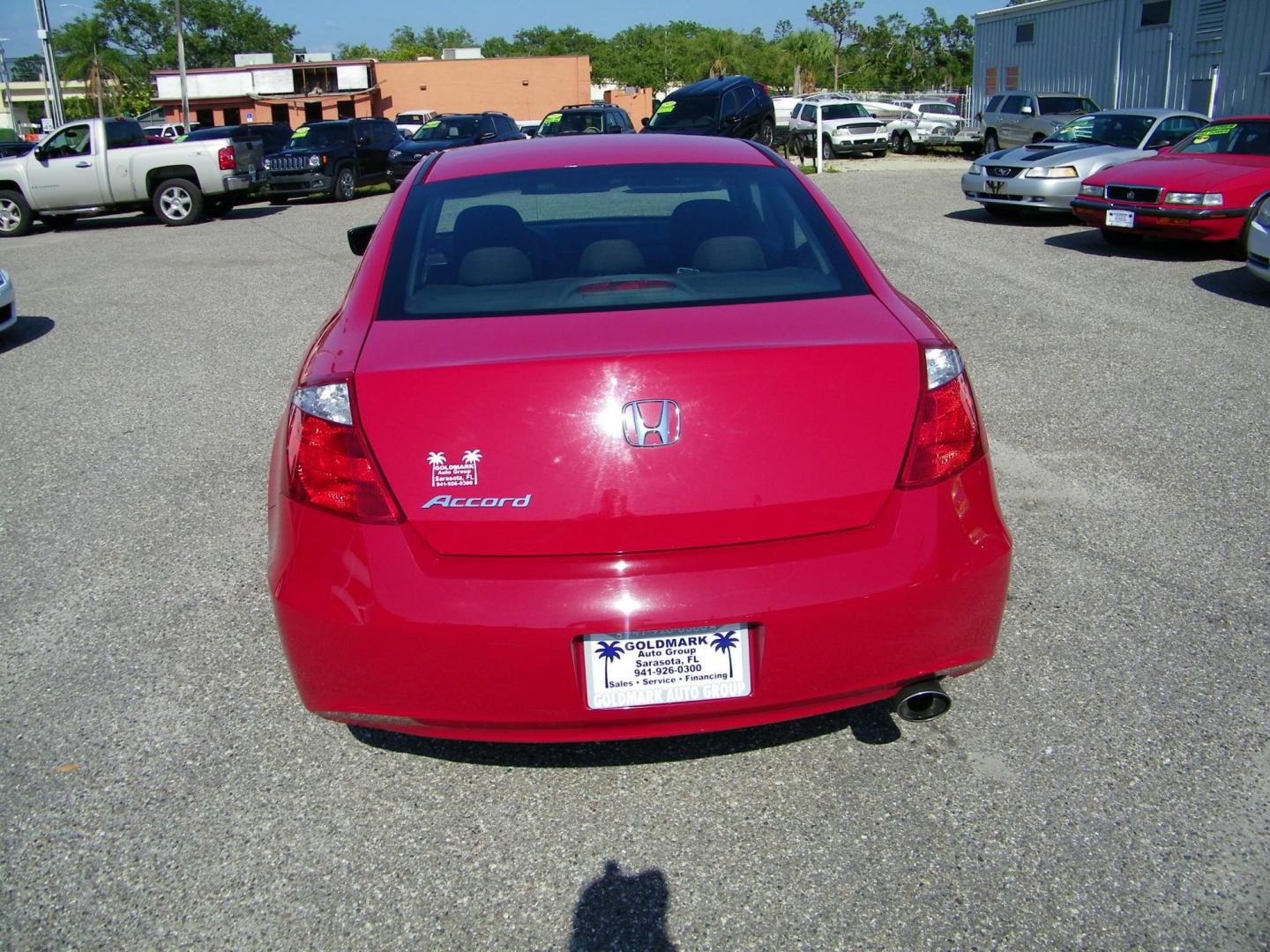 2009 Red /Black Honda Accord EX Coupe AT (1HGCS12759A) with an 2.4L L4 DOHC 16V engine, 5-Speed Automatic transmission, located at 4000 Bee Ridge Road, Sarasota, FL, 34233, (941) 926-0300, 27.298664, -82.489151 - Photo#4