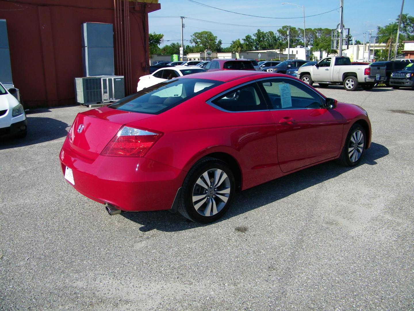 2009 Red /Black Honda Accord EX Coupe AT (1HGCS12759A) with an 2.4L L4 DOHC 16V engine, 5-Speed Automatic transmission, located at 4000 Bee Ridge Road, Sarasota, FL, 34233, (941) 926-0300, 27.298664, -82.489151 - Photo#5