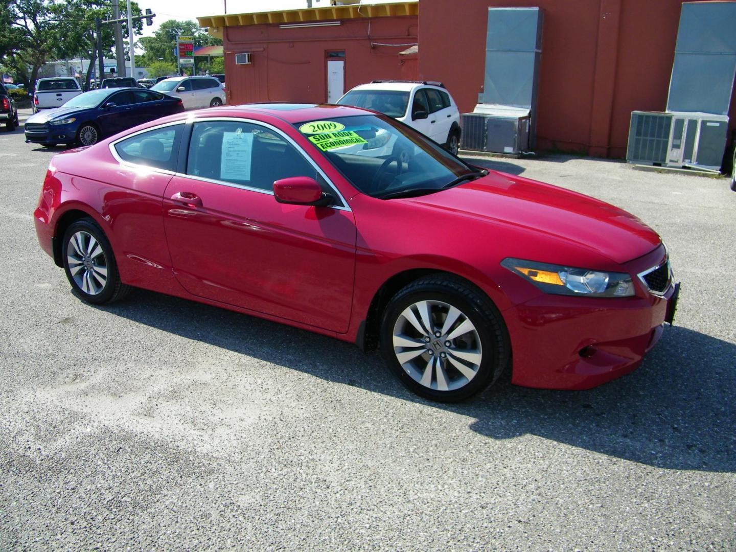 2009 Red /Black Honda Accord EX Coupe AT (1HGCS12759A) with an 2.4L L4 DOHC 16V engine, 5-Speed Automatic transmission, located at 4000 Bee Ridge Road, Sarasota, FL, 34233, (941) 926-0300, 27.298664, -82.489151 - Photo#7