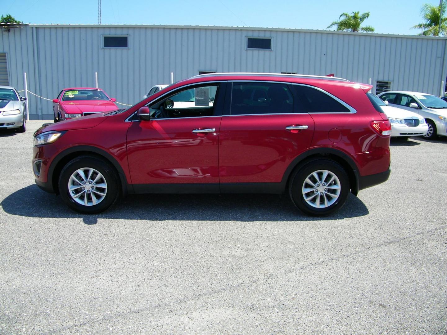 2018 Red /Black Kia Sorento LX 2WD (5XYPG4A36JG) with an 2.4L L4 DOHC 16V engine, 6A transmission, located at 4000 Bee Ridge Road, Sarasota, FL, 34233, (941) 926-0300, 27.298664, -82.489151 - Photo#2