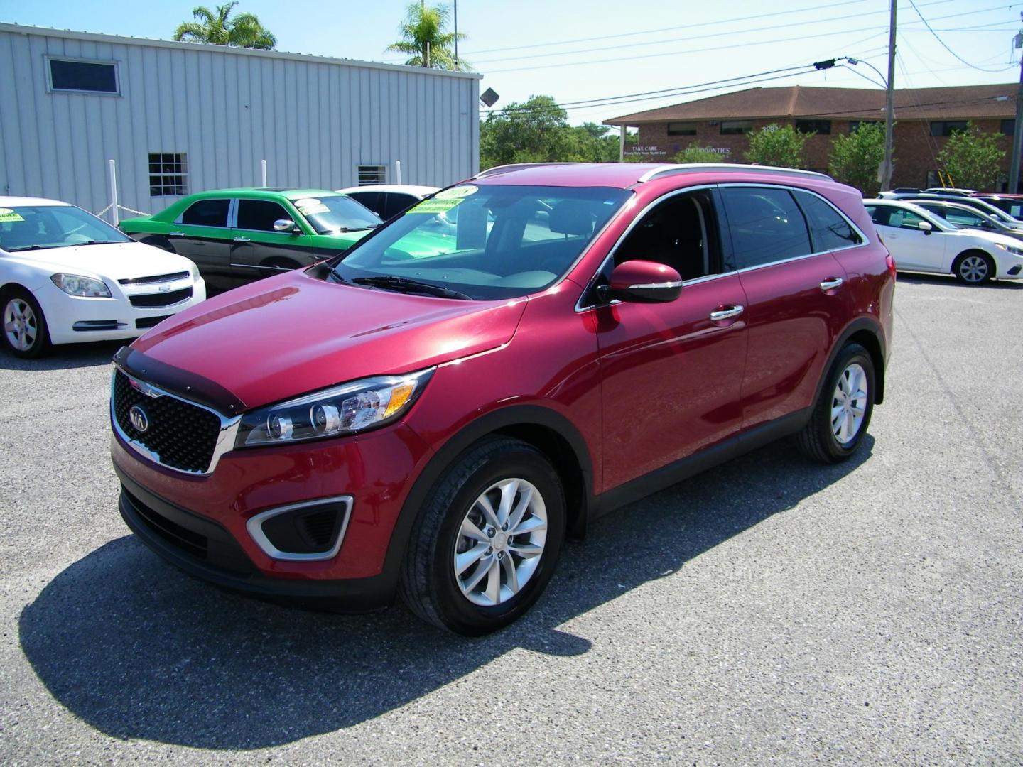 2018 Red /Black Kia Sorento LX 2WD (5XYPG4A36JG) with an 2.4L L4 DOHC 16V engine, 6A transmission, located at 4000 Bee Ridge Road, Sarasota, FL, 34233, (941) 926-0300, 27.298664, -82.489151 - Photo#0
