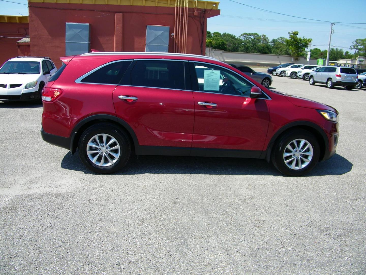 2018 Red /Black Kia Sorento LX 2WD (5XYPG4A36JG) with an 2.4L L4 DOHC 16V engine, 6A transmission, located at 4000 Bee Ridge Road, Sarasota, FL, 34233, (941) 926-0300, 27.298664, -82.489151 - Photo#6