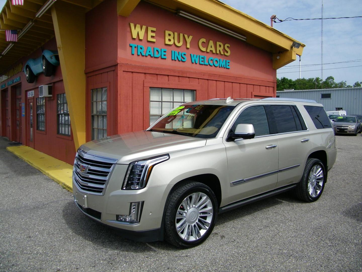2017 Gold /Brown Cadillac Escalade Platinum 4WD (1GYS4DKJ7HR) with an 6.2L V8 OHV 16V FFV engine, 8A transmission, located at 4000 Bee Ridge Road, Sarasota, FL, 34233, (941) 926-0300, 27.298664, -82.489151 - Photo#1