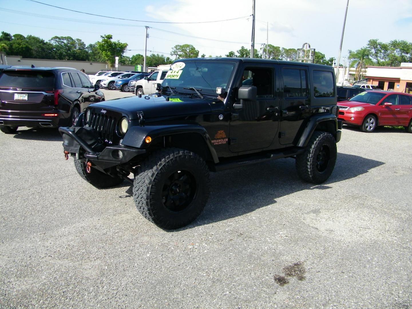 2014 Black /Black Jeep Wrangler Unlimited Sport 4WD (1C4BJWDG5EL) with an 3.6L V6 DOHC 24V FFV engine, Automatic transmission, located at 4000 Bee Ridge Road, Sarasota, FL, 34233, (941) 926-0300, 27.298664, -82.489151 - Photo#0