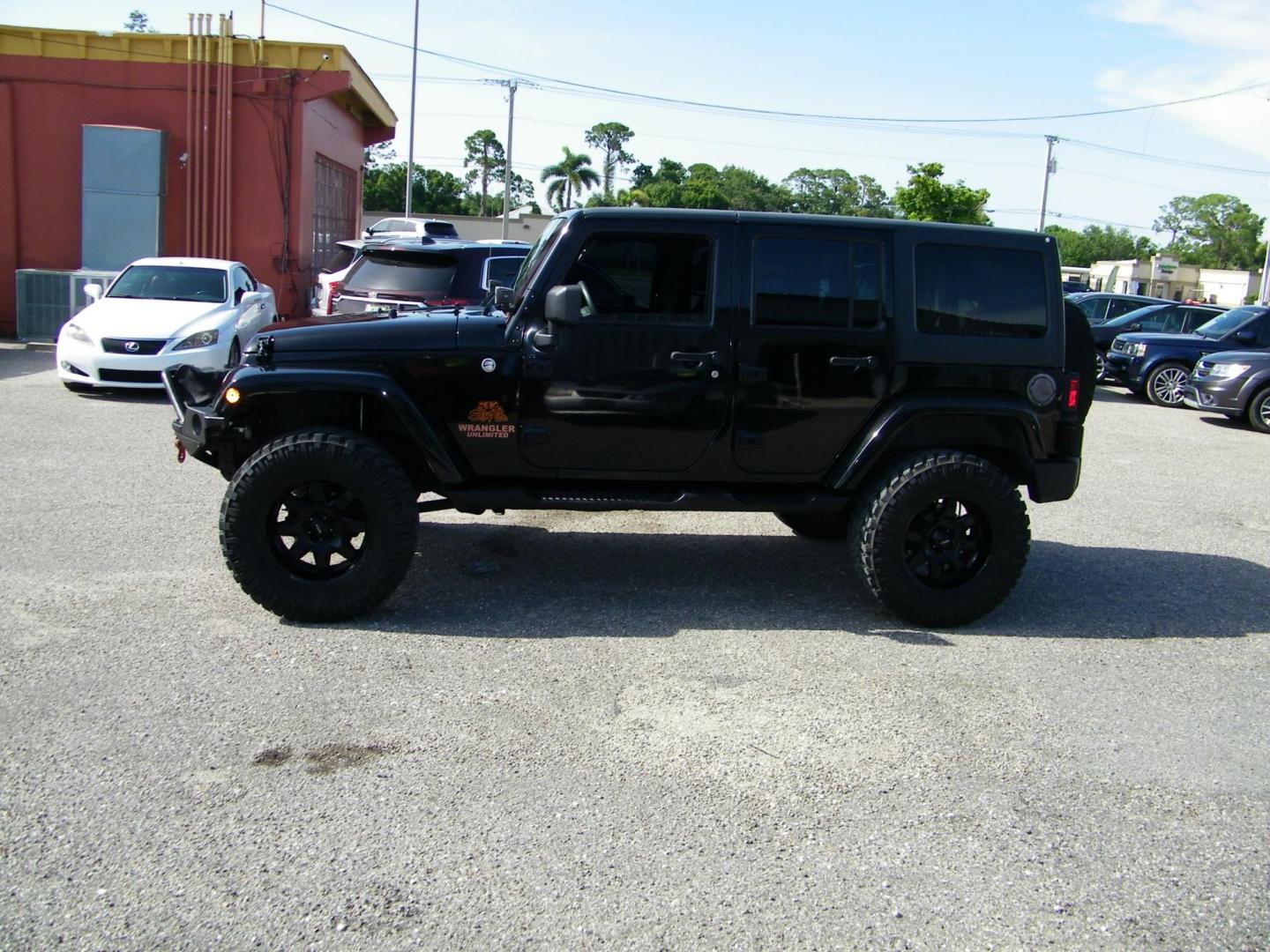 2014 Black /Black Jeep Wrangler Unlimited Sport 4WD (1C4BJWDG5EL) with an 3.6L V6 DOHC 24V FFV engine, Automatic transmission, located at 4000 Bee Ridge Road, Sarasota, FL, 34233, (941) 926-0300, 27.298664, -82.489151 - Photo#2