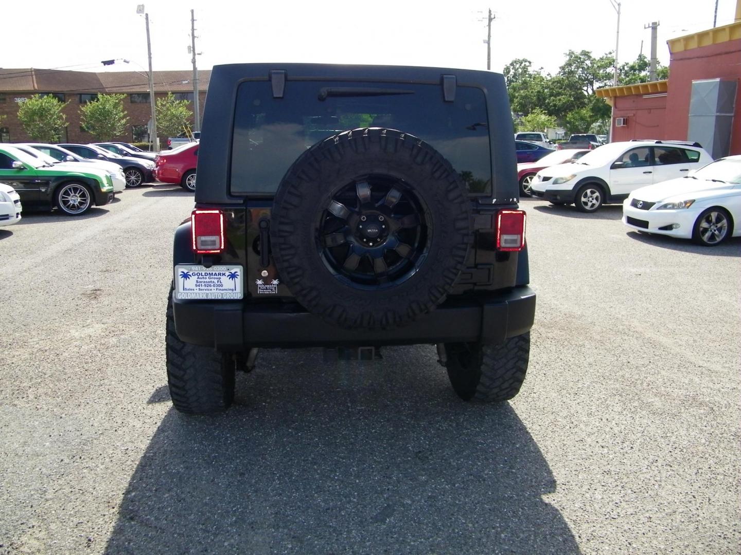 2014 Black /Black Jeep Wrangler Unlimited Sport 4WD (1C4BJWDG5EL) with an 3.6L V6 DOHC 24V FFV engine, Automatic transmission, located at 4000 Bee Ridge Road, Sarasota, FL, 34233, (941) 926-0300, 27.298664, -82.489151 - Photo#4