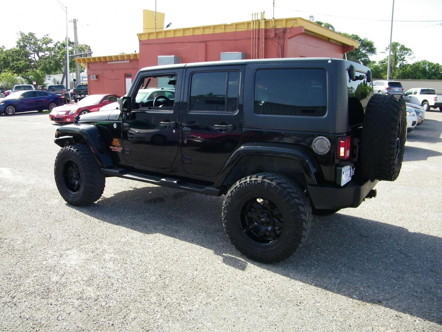 2014 Black /Black Jeep Wrangler Unlimited Sport 4WD (1C4BJWDG5EL) with an 3.6L V6 DOHC 24V FFV engine, Automatic transmission, located at 4000 Bee Ridge Road, Sarasota, FL, 34233, (941) 926-0300, 27.298664, -82.489151 - Photo#3