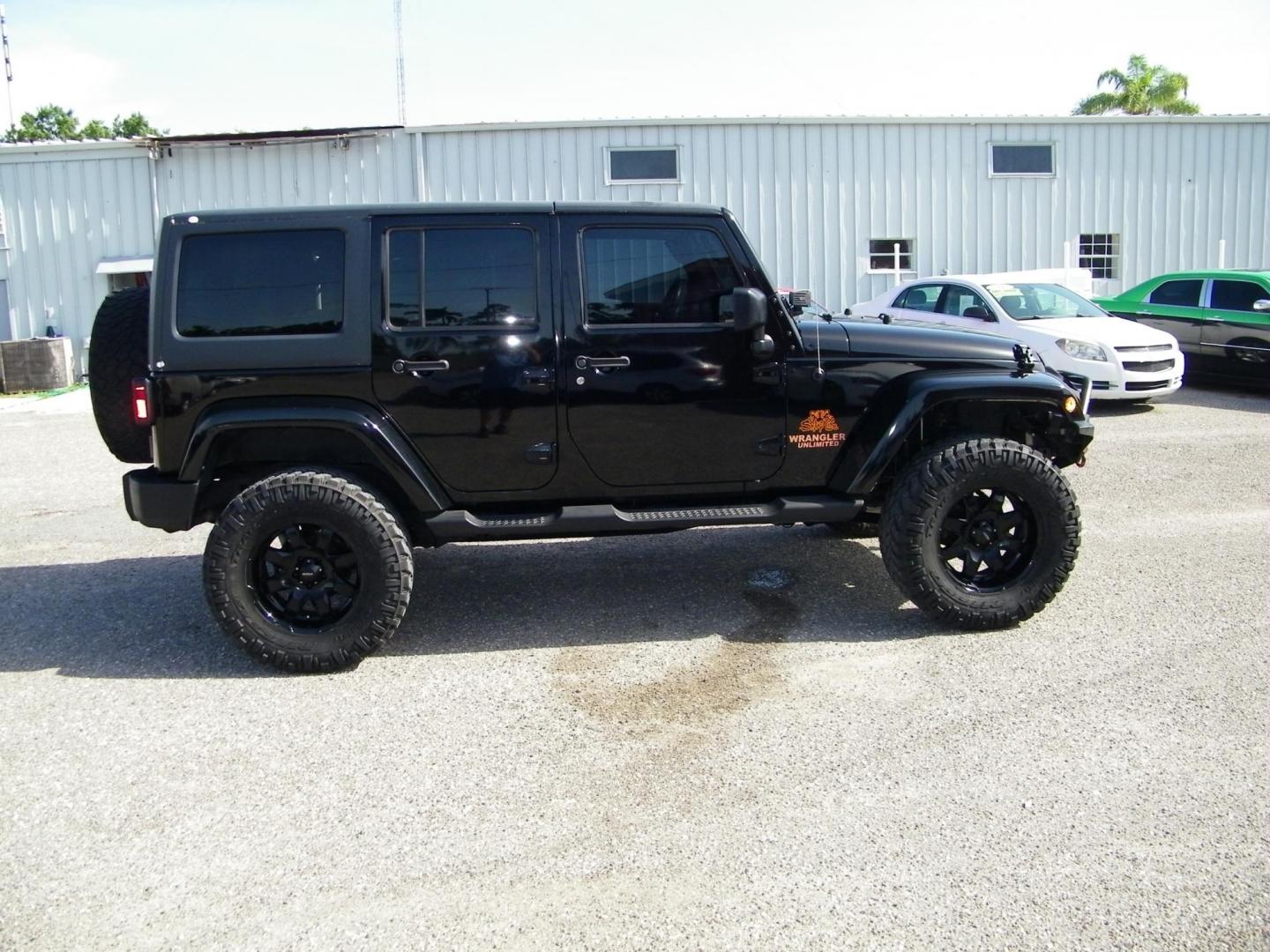 2014 Black /Black Jeep Wrangler Unlimited Sport 4WD (1C4BJWDG5EL) with an 3.6L V6 DOHC 24V FFV engine, Automatic transmission, located at 4000 Bee Ridge Road, Sarasota, FL, 34233, (941) 926-0300, 27.298664, -82.489151 - Photo#6