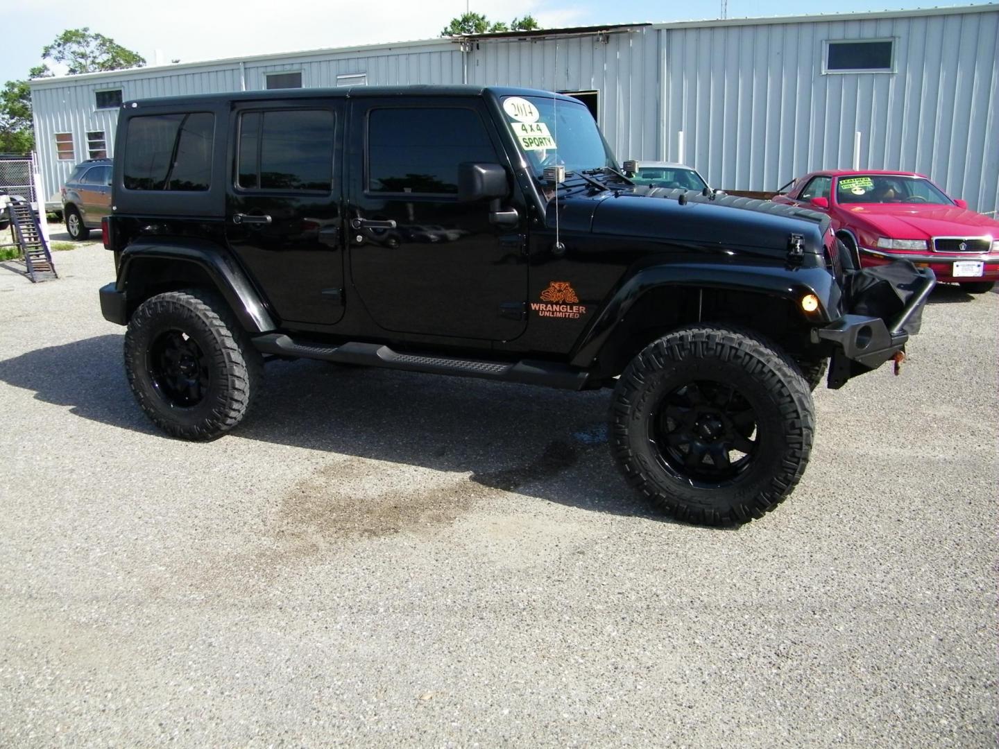 2014 Black /Black Jeep Wrangler Unlimited Sport 4WD (1C4BJWDG5EL) with an 3.6L V6 DOHC 24V FFV engine, Automatic transmission, located at 4000 Bee Ridge Road, Sarasota, FL, 34233, (941) 926-0300, 27.298664, -82.489151 - Photo#7