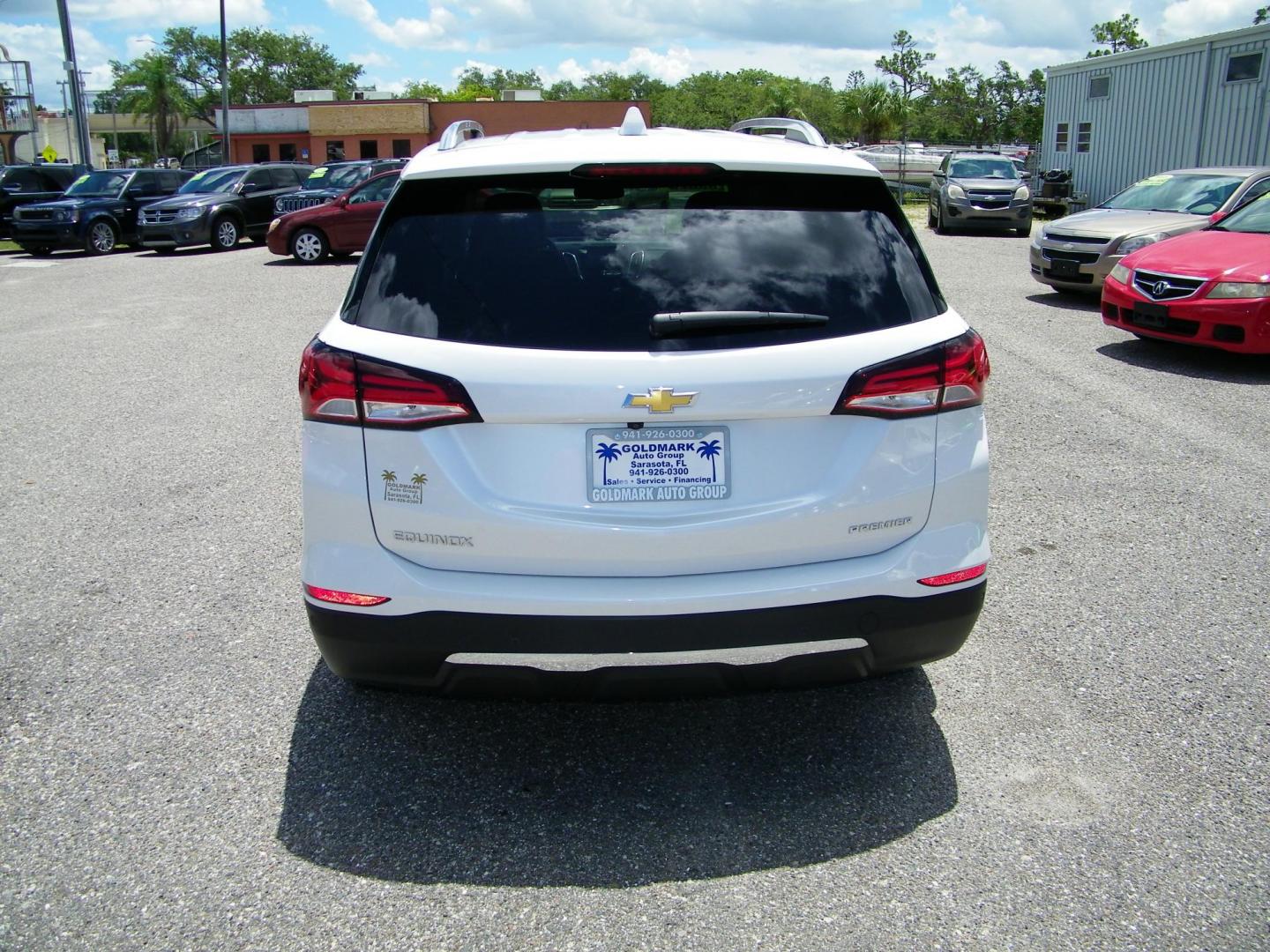 2022 White /Black Chevrolet Equinox Premier (3GNAXNEV8NS) with an 1.5L L4 DOHC 16V TURBO engine, 6A transmission, located at 4000 Bee Ridge Road, Sarasota, FL, 34233, (941) 926-0300, 27.298664, -82.489151 - Photo#4