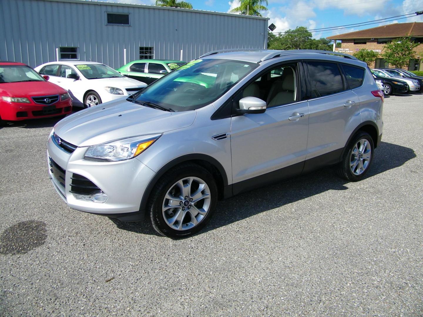 2016 Silver /Beige Ford Escape Titanium FWD (1FMCU0J95GU) with an 2.0L L4 DOHC 16V engine, 6-Speed Automatic transmission, located at 4000 Bee Ridge Road, Sarasota, FL, 34233, (941) 926-0300, 27.298664, -82.489151 - Photo#0