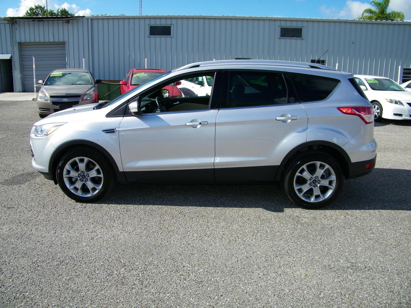 2016 Silver /Beige Ford Escape Titanium FWD (1FMCU0J95GU) with an 2.0L L4 DOHC 16V engine, 6-Speed Automatic transmission, located at 4000 Bee Ridge Road, Sarasota, FL, 34233, (941) 926-0300, 27.298664, -82.489151 - Photo#2