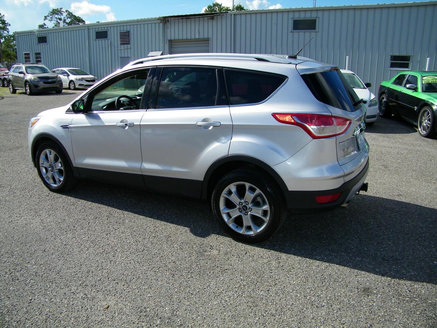 2016 Silver /Beige Ford Escape Titanium FWD (1FMCU0J95GU) with an 2.0L L4 DOHC 16V engine, 6-Speed Automatic transmission, located at 4000 Bee Ridge Road, Sarasota, FL, 34233, (941) 926-0300, 27.298664, -82.489151 - Photo#3