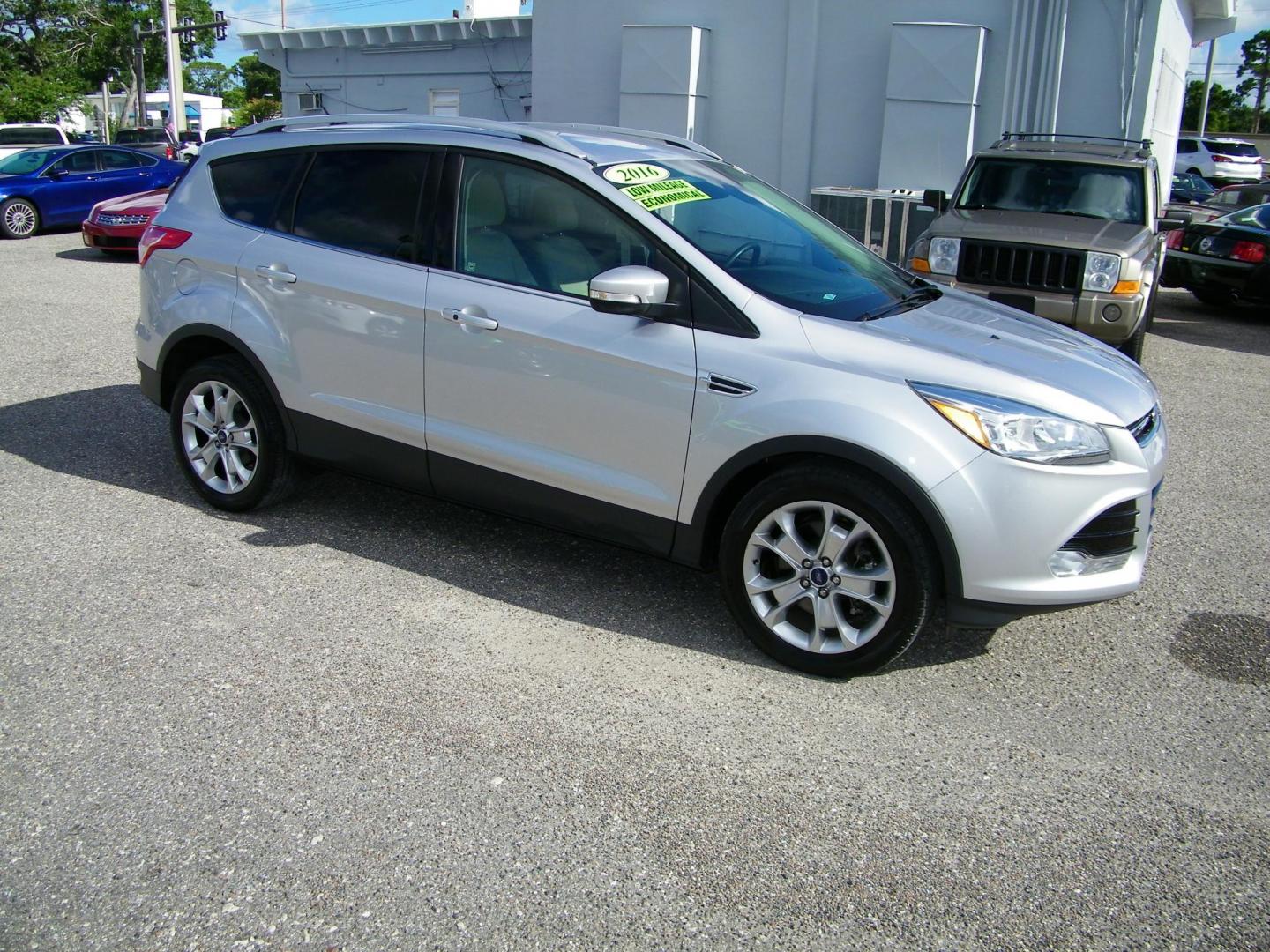2016 Silver /Beige Ford Escape Titanium FWD (1FMCU0J95GU) with an 2.0L L4 DOHC 16V engine, 6-Speed Automatic transmission, located at 4000 Bee Ridge Road, Sarasota, FL, 34233, (941) 926-0300, 27.298664, -82.489151 - Photo#7