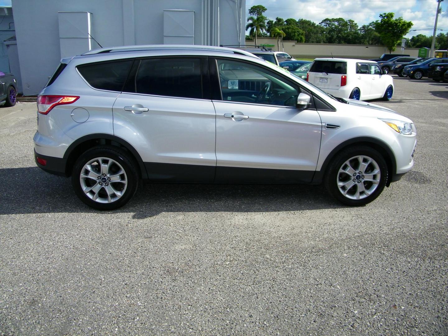 2016 Silver /Beige Ford Escape Titanium FWD (1FMCU0J95GU) with an 2.0L L4 DOHC 16V engine, 6-Speed Automatic transmission, located at 4000 Bee Ridge Road, Sarasota, FL, 34233, (941) 926-0300, 27.298664, -82.489151 - Photo#6