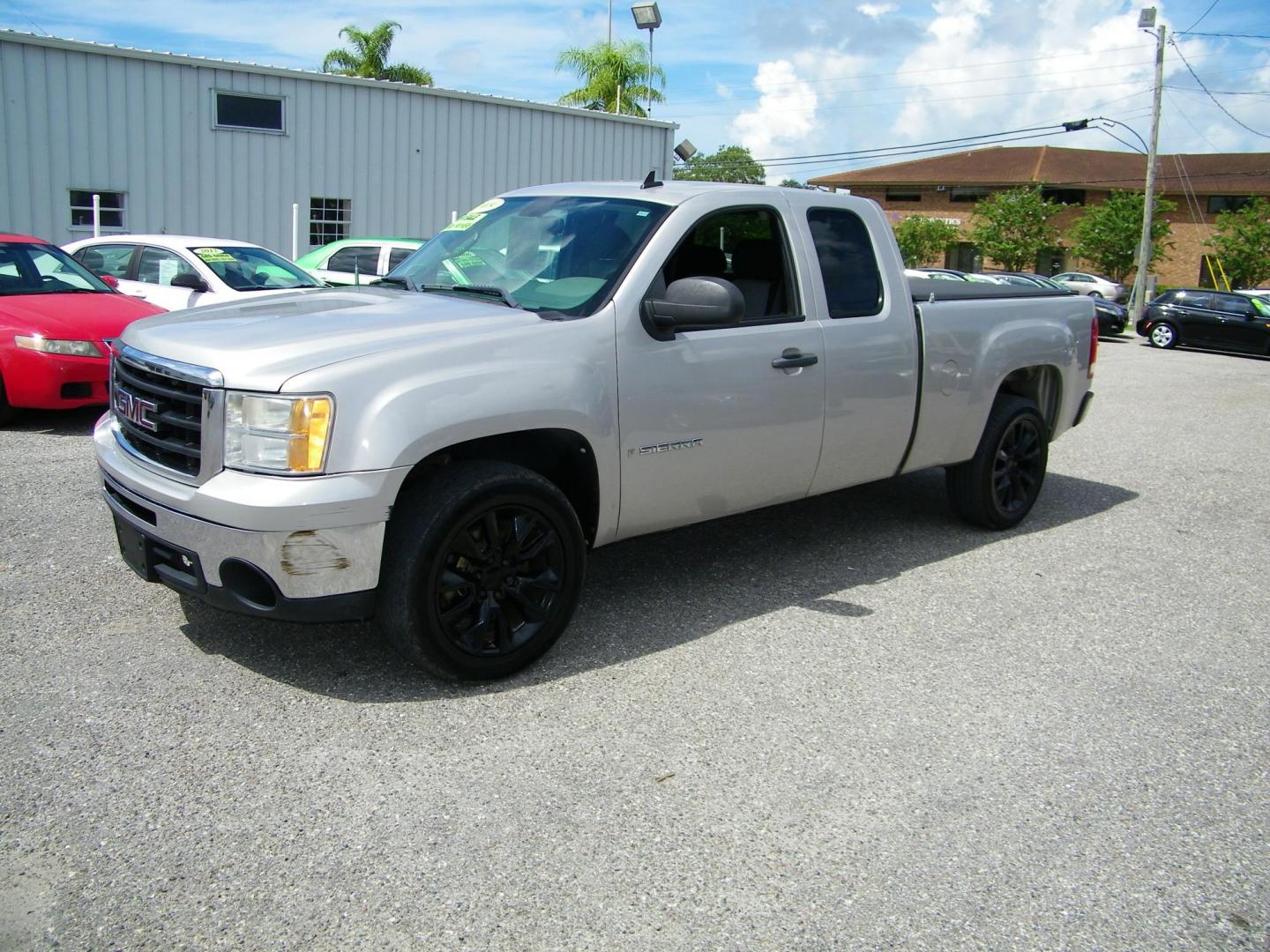 2009 Gold /Black GMC Sierra 1500 Work Truck Ext. Cab Long Box 2WD (2GTEC19C691) with an 4.8L V8 OHV 16V engine, 4-Speed Automatic transmission, located at 4000 Bee Ridge Road, Sarasota, FL, 34233, (941) 926-0300, 27.298664, -82.489151 - Photo#4