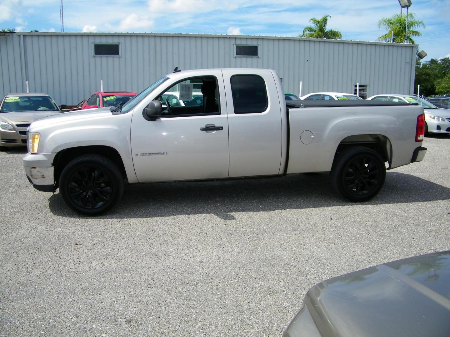 2009 Gold /Black GMC Sierra 1500 Work Truck Ext. Cab Long Box 2WD (2GTEC19C691) with an 4.8L V8 OHV 16V engine, 4-Speed Automatic transmission, located at 4000 Bee Ridge Road, Sarasota, FL, 34233, (941) 926-0300, 27.298664, -82.489151 - Photo#2
