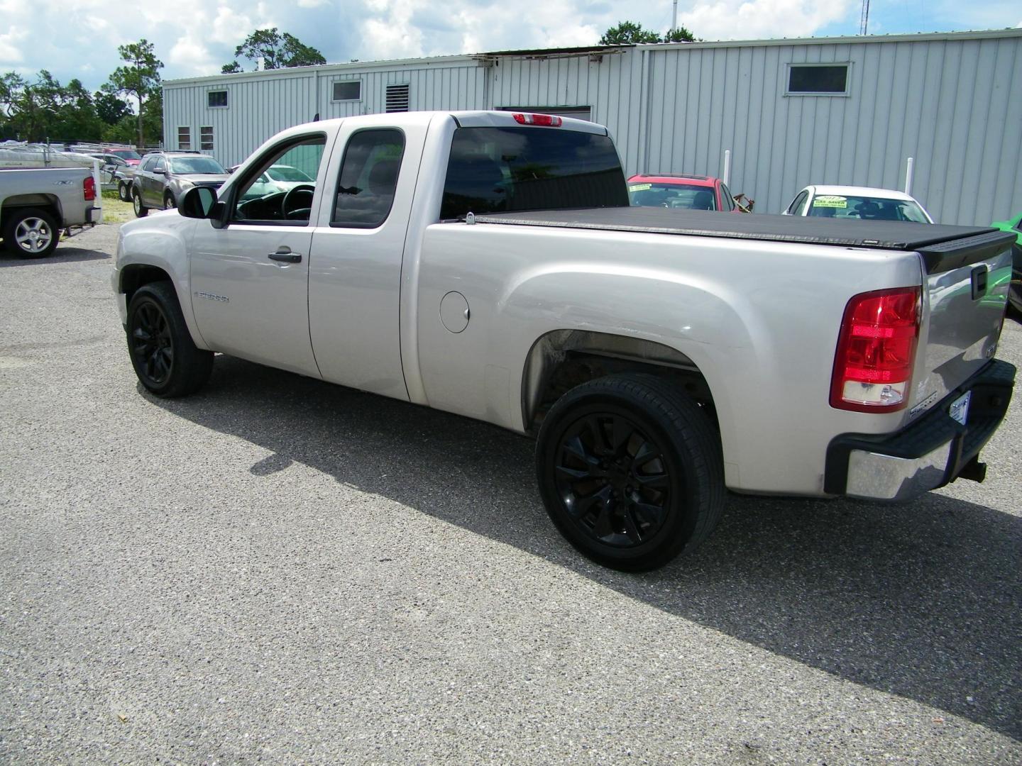 2009 Gold /Black GMC Sierra 1500 Work Truck Ext. Cab Long Box 2WD (2GTEC19C691) with an 4.8L V8 OHV 16V engine, 4-Speed Automatic transmission, located at 4000 Bee Ridge Road, Sarasota, FL, 34233, (941) 926-0300, 27.298664, -82.489151 - Photo#3