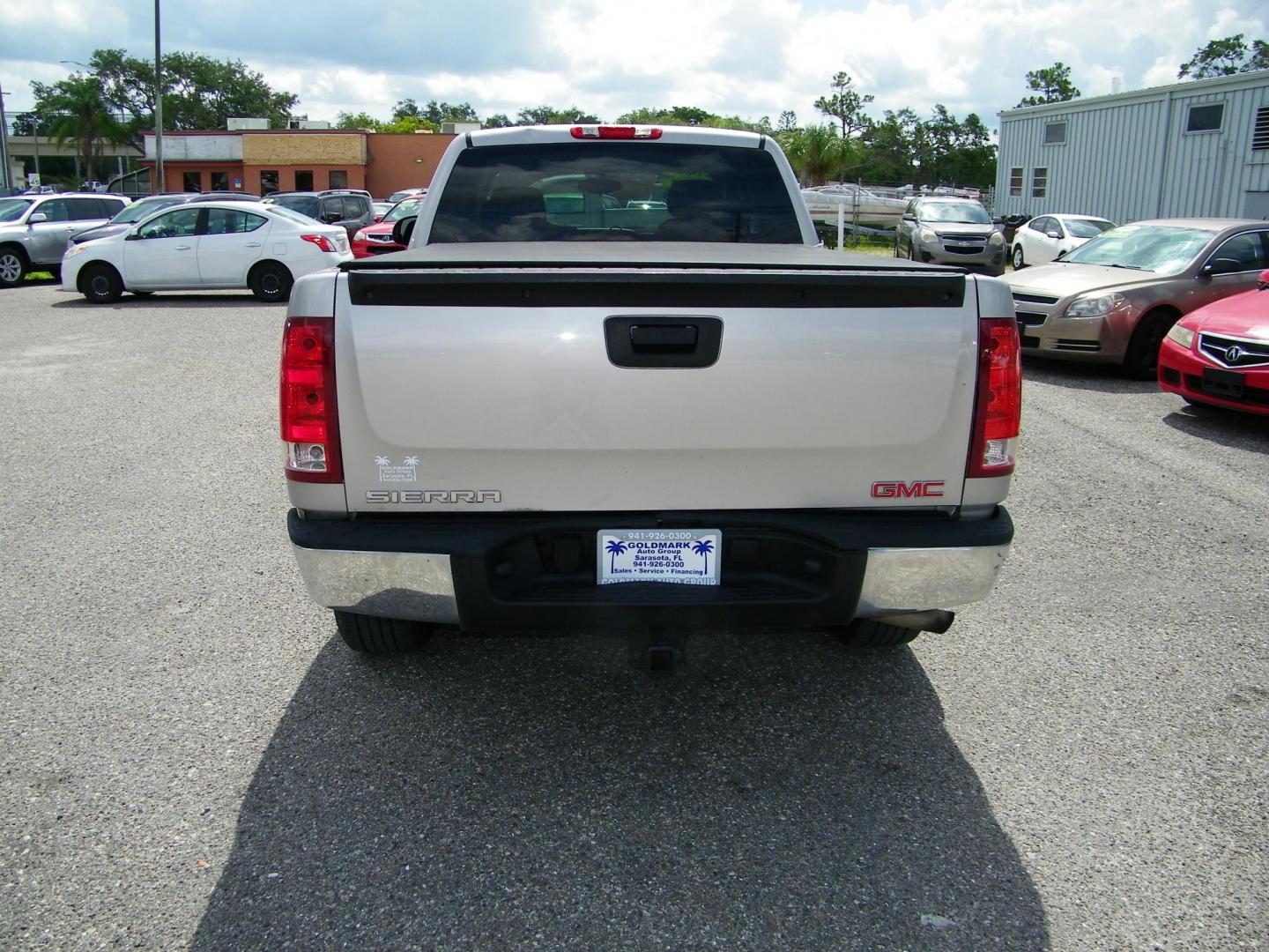 2009 Gold /Black GMC Sierra 1500 Work Truck Ext. Cab Long Box 2WD (2GTEC19C691) with an 4.8L V8 OHV 16V engine, 4-Speed Automatic transmission, located at 4000 Bee Ridge Road, Sarasota, FL, 34233, (941) 926-0300, 27.298664, -82.489151 - Photo#5