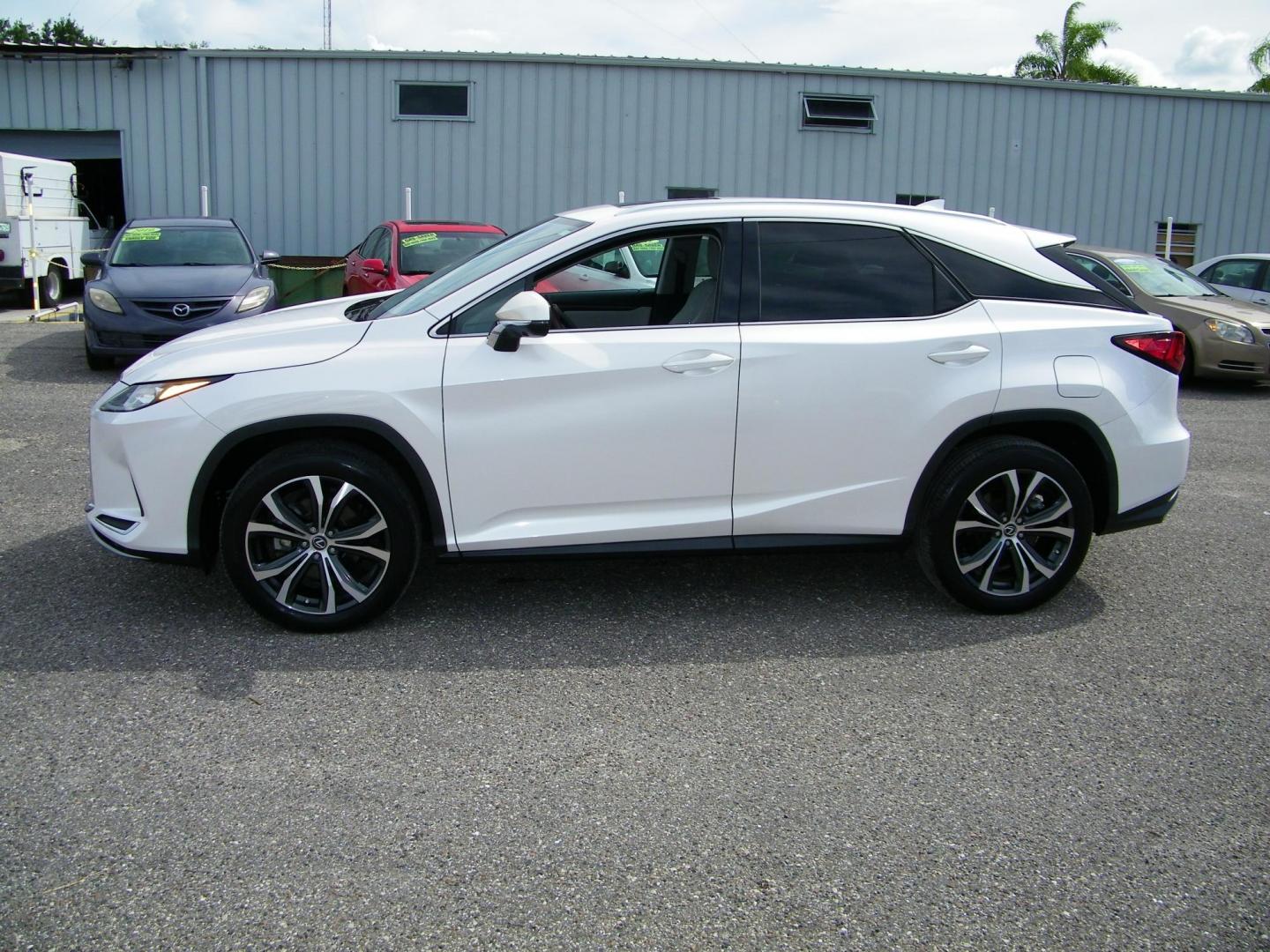 2021 White /Tan Lexus RX 350 FWD (2T2HZMAA8MC) with an 3.5L V6 DOHC 24V engine, 6A transmission, located at 4000 Bee Ridge Road, Sarasota, FL, 34233, (941) 926-0300, 27.298664, -82.489151 - Photo#2