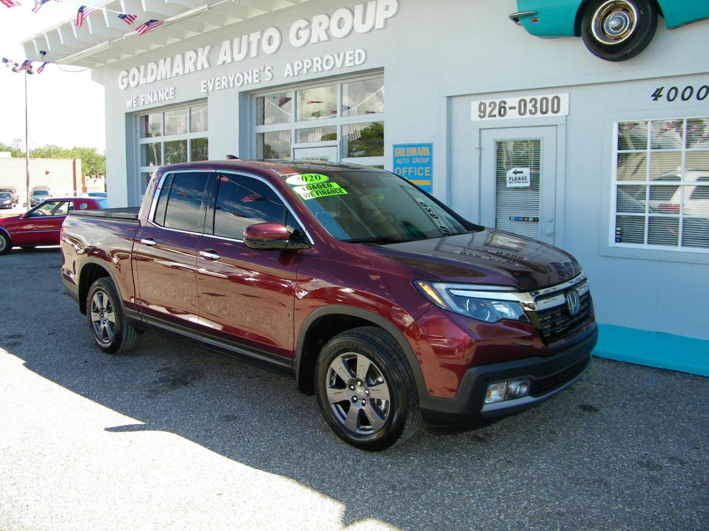 2020 Maroon /Beige Honda Ridgeline RTL-E AWD (5FPYK3F70LB) with an 3.5L V6 SOHC 24V engine, 6A transmission, located at 4000 Bee Ridge Road, Sarasota, FL, 34233, (941) 926-0300, 27.298664, -82.489151 - Photo#1