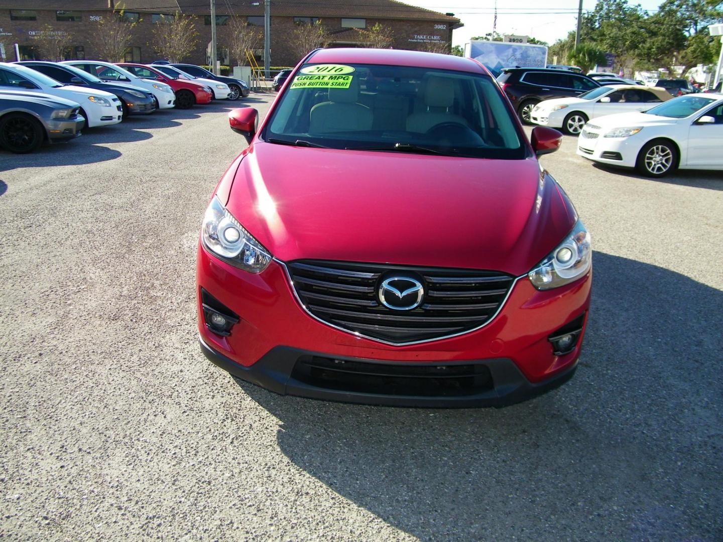 2016 Red /Beige Mazda CX-5 Touring (JM3KE2CY0G0) with an 2.5L L4 DOHC 16V engine, 6-Speed Automatic transmission, located at 4000 Bee Ridge Road, Sarasota, FL, 34233, (941) 926-0300, 27.298664, -82.489151 - Photo#1