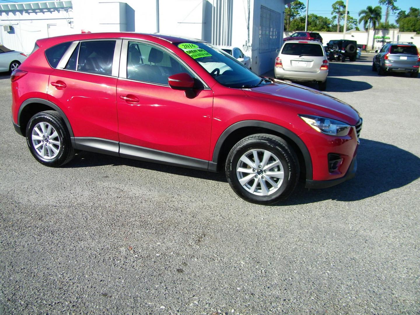 2016 Red /Beige Mazda CX-5 Touring (JM3KE2CY0G0) with an 2.5L L4 DOHC 16V engine, 6-Speed Automatic transmission, located at 4000 Bee Ridge Road, Sarasota, FL, 34233, (941) 926-0300, 27.298664, -82.489151 - Photo#7